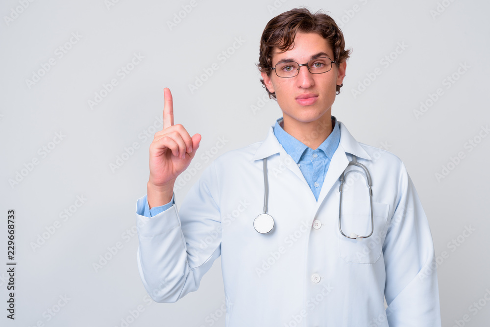 Portrait of young handsome man doctor with eyeglasses Portrait of young handsome man doctor with eyeglasses