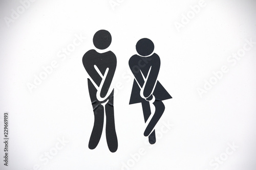 Male and female toilet symbols on white