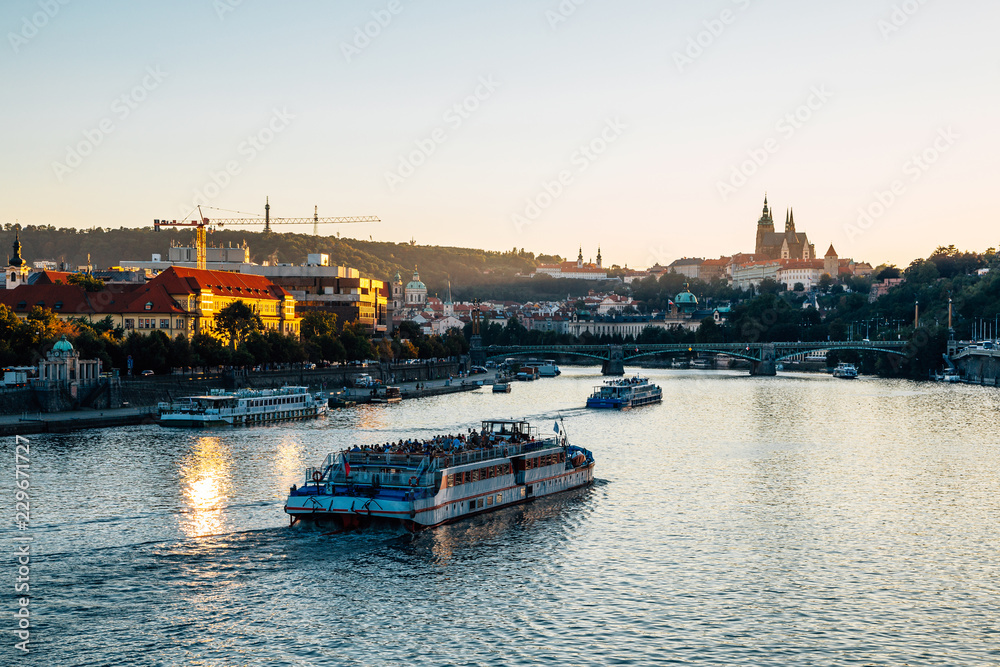 Prague city old buildings and Vltava river with sunset in Prague, Czech