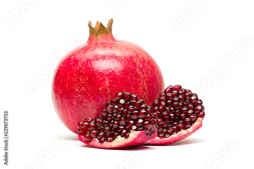 Pomegranate fruit with slices on white background, exotic tropical fruit, healthy food, diet nutrition 