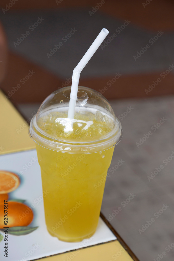 Chrysanthemum ice tea in plastic glass on table