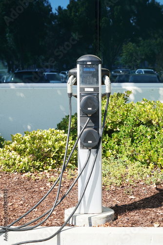 close up on electric vehicle charger station in the parking area