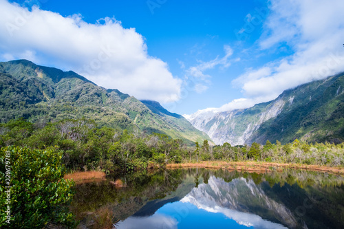 Beautiful landscape of the mountain and the reflection on the lake. Amazing greenery. © Klanarong Chitmung