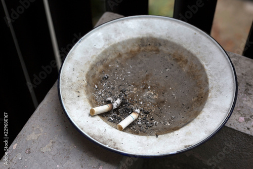 Cigarette butts in plate