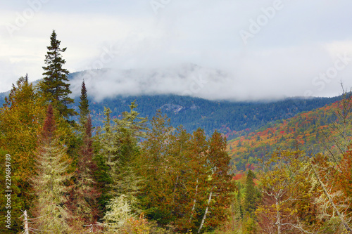 Misty clouds pass in front of Sugarloaf Mountain in Maine.
