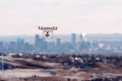 Drone hovers over Denver city skyline at sunrise