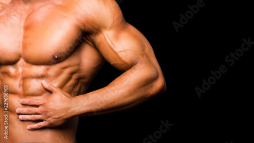 Portrait of sporty strong muscle. Sport workout bodybuilding motivation concept. Sexy naked torso, six pack abs. Male flexing his muscles