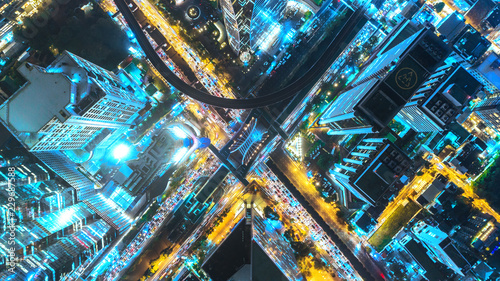 Aerial view traffic road at night in downtown for transportation or traffic background.
