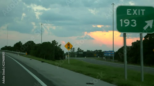 Doing down the highway, exit sign. photo