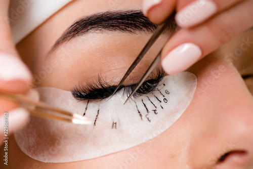 Leinwand Poster Eyelash extension procedure close up