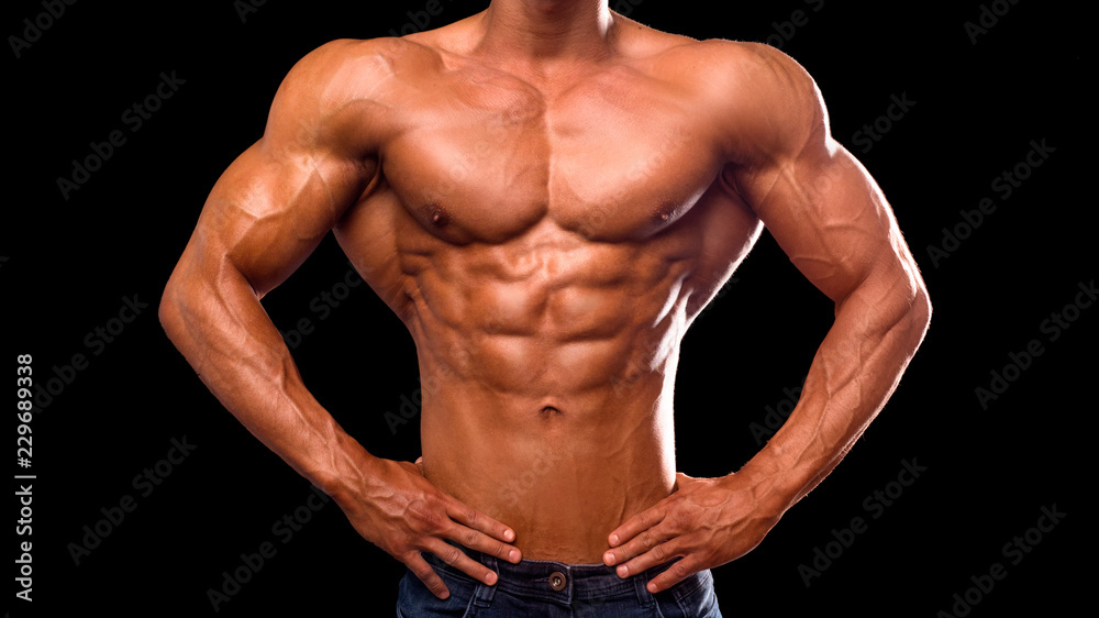 Muscular and sexy torso of young sporty man bodybuilder in jeans with perfect abs, bicep and chest. Muscular and sexy torso of young sporty man bodybuilder in jeans with perfect abs, bicep and chest.