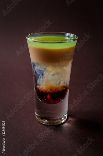 Wallpaper Mural Hiroshima alcoholic shot glass with absent, sambuca, irish cream on elegant dark brown background Torontodigital.ca