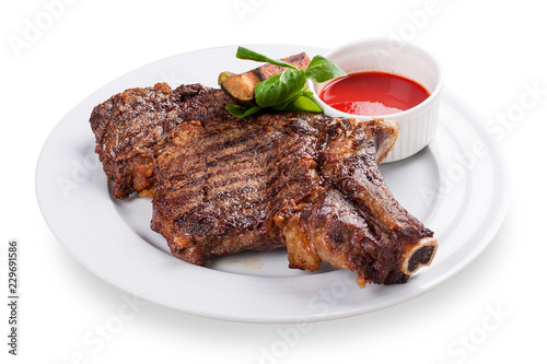 Veal steak on the bone. On a white background