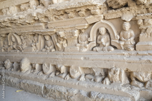 Bas-relief of Buddha and monks on the Stupa at Jaulian monastery, Taxila.