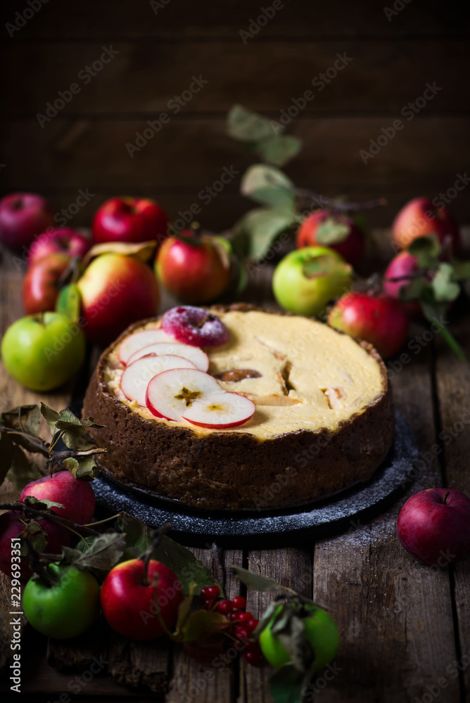 Apple Cheesecake with a Brown Butter Crust. .Dark rustic photo