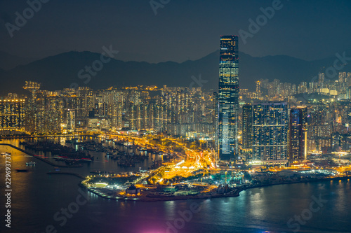 View of hong kong skyline at night  mountains in the background  modern skyscrapers at night
