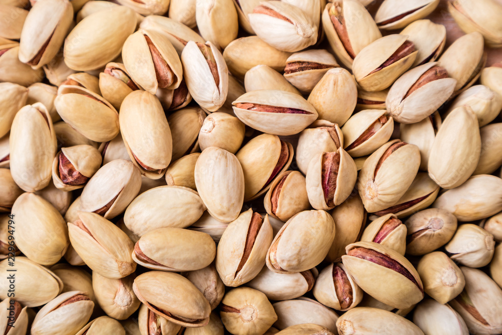 Pistachios nuts background. Pistachio texture. Top view