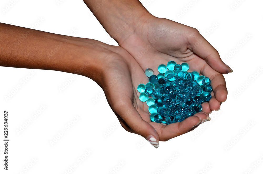 Water hydrogel pearls and hand Water hydrogel pearls and hand