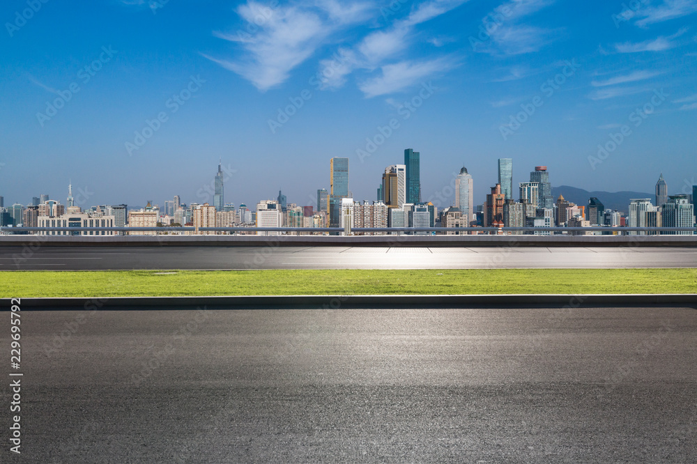 Panoramic skyline and modern business office buildings with empty road,empty concrete square floor