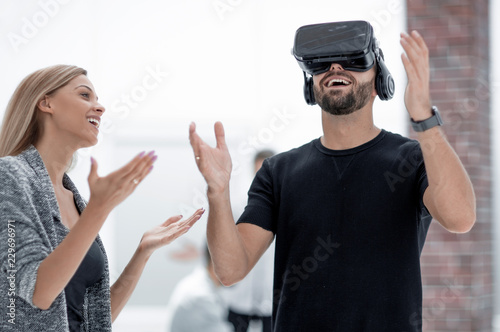 Young Caucasian man using virtual reality headset glasses