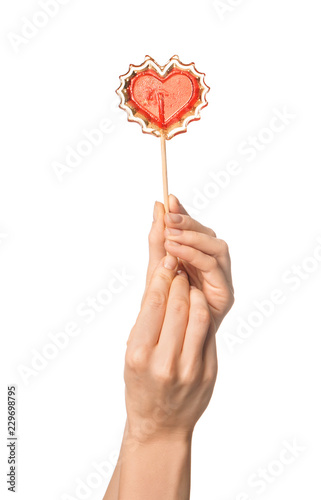 Female hands holding red he...