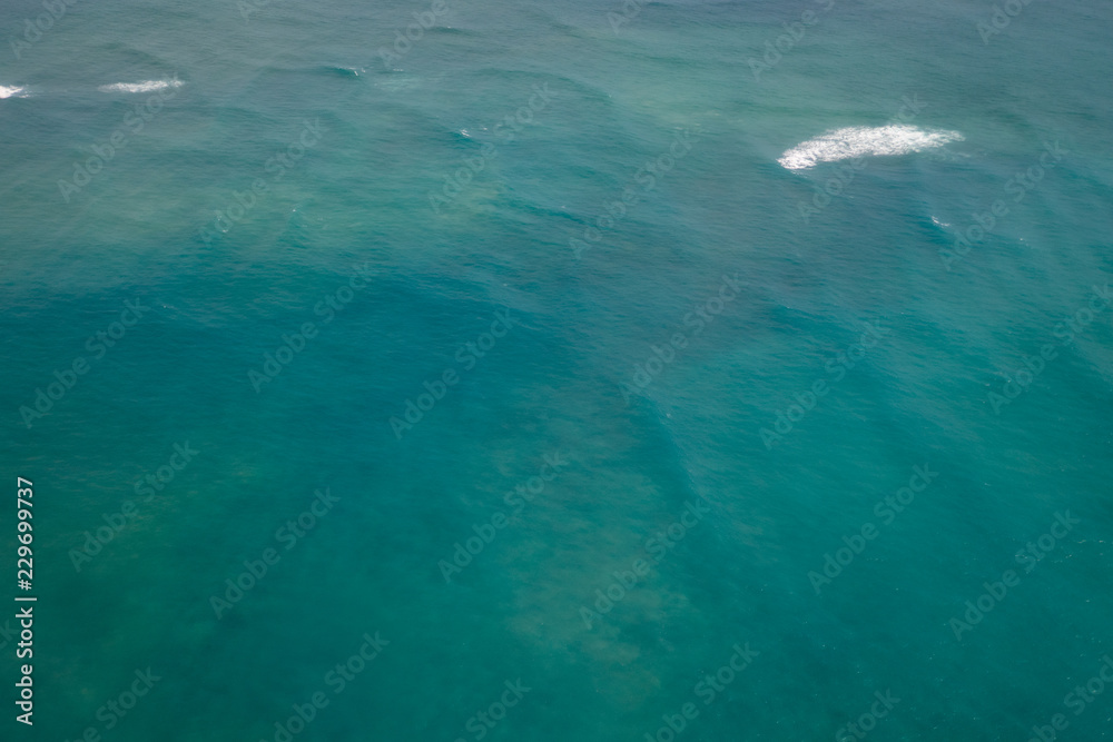 Turquoise blue water of Mamala Bay seen from the air, Honolulu, Hawaii