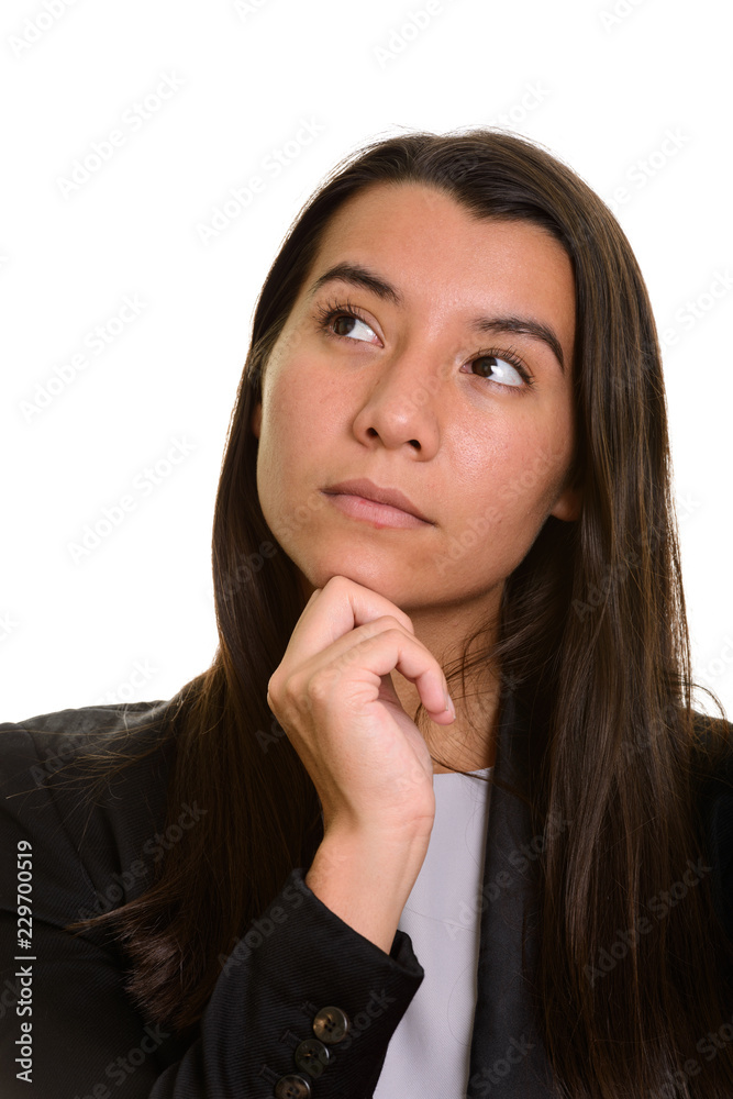 Young Caucasian businesswoman thinking and looking up Young Caucasian businesswoman thinking and looking up