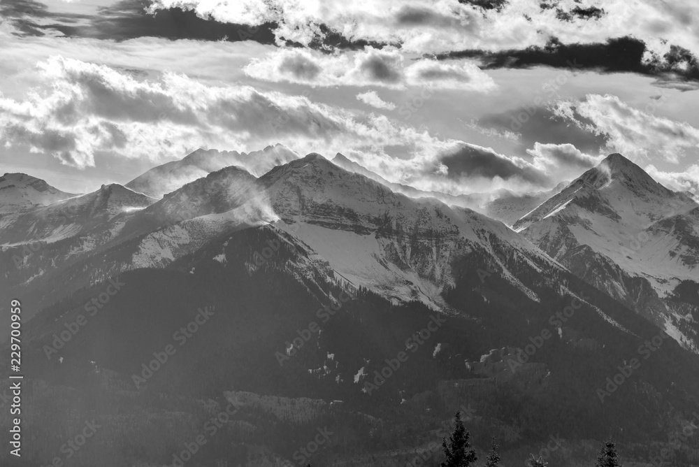 Snow blow throught cloud top San Juan Mountains in Black and White, Telluride, Colorado, USA, View from Alta Lake