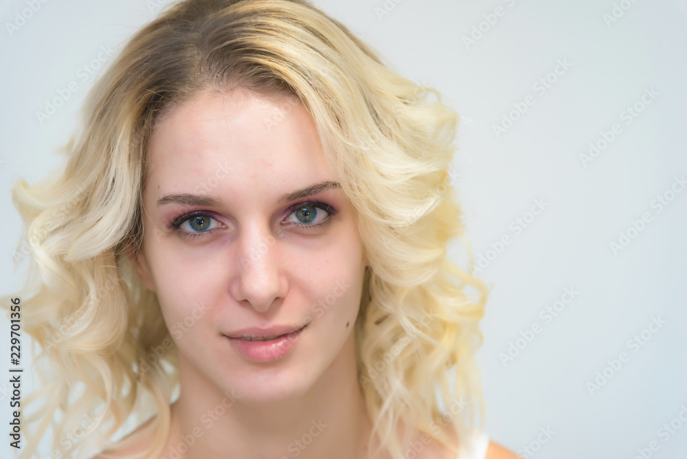 Portrait of a beautiful blonde girl while working as a professional beautician make-up artist. Portrait of a beautiful blonde girl while working as a professional beautician make-up artist.