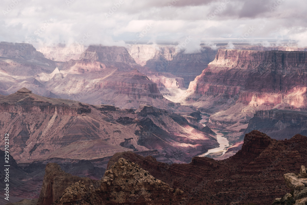 Amazing view of Grand Canyon on cloudy sky background Amazing view of Grand Canyon on cloudy sky background