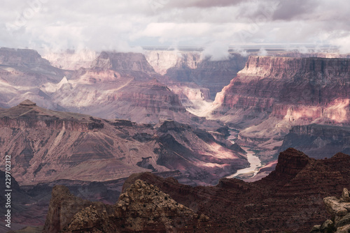 Amazing view of Grand Canyon on cloudy sky background