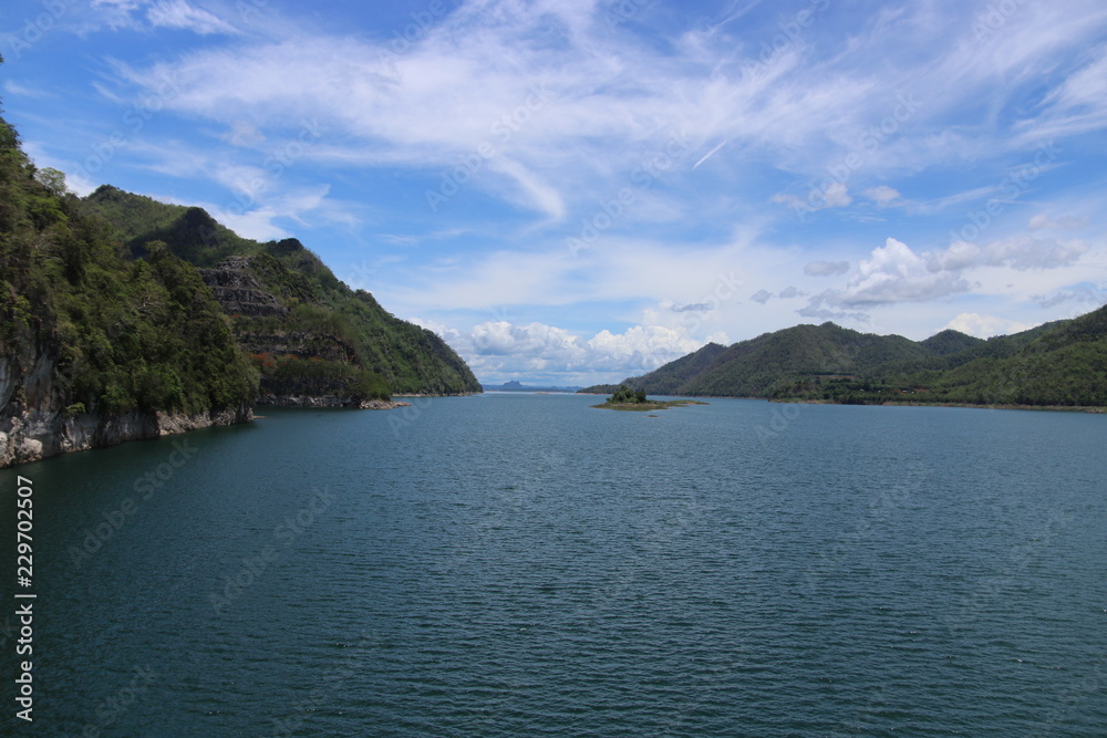 The beautiful landscape of hills covered with forests, and the sky was covered with clouds and the river. The beautiful landscape of hills covered with forests, and the sky was covered with clouds and the river.