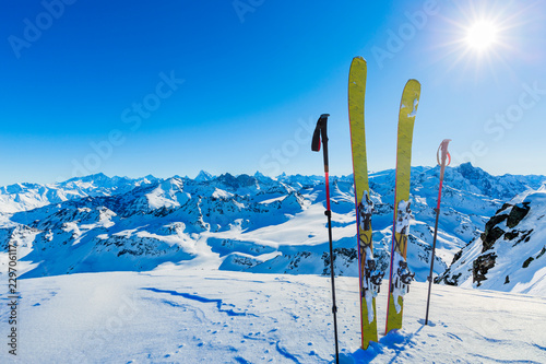 SSki in winter season, mountains and ski touring backcountry equipments on the top of snowy mountains in sunny day, Verbier Switzerland.