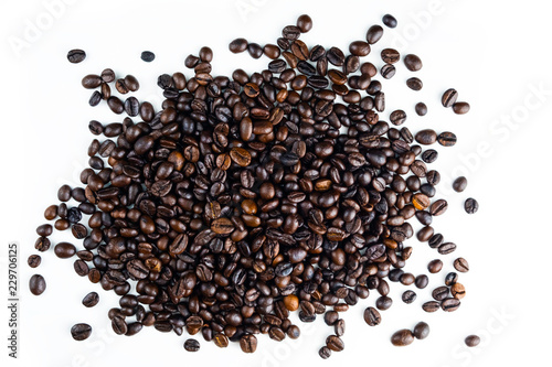 Pile of coffee beans isolated top viwe on white background.