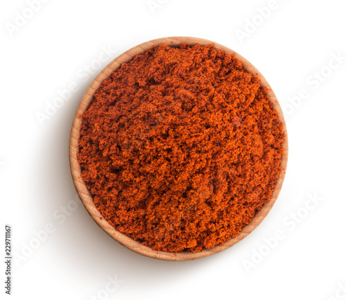 Fotografiet Red paprika powder isolated on white background. Top view