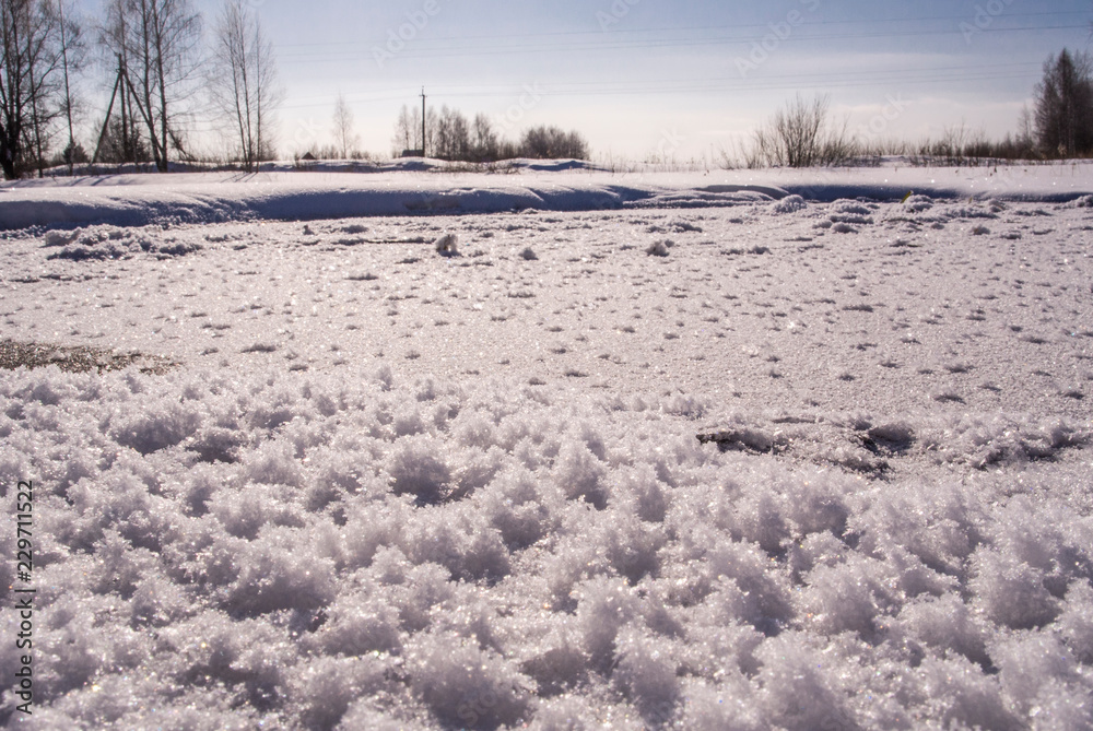 Frozen water of lake with snowflakes on surface Frozen water of lake with snowflakes on surface