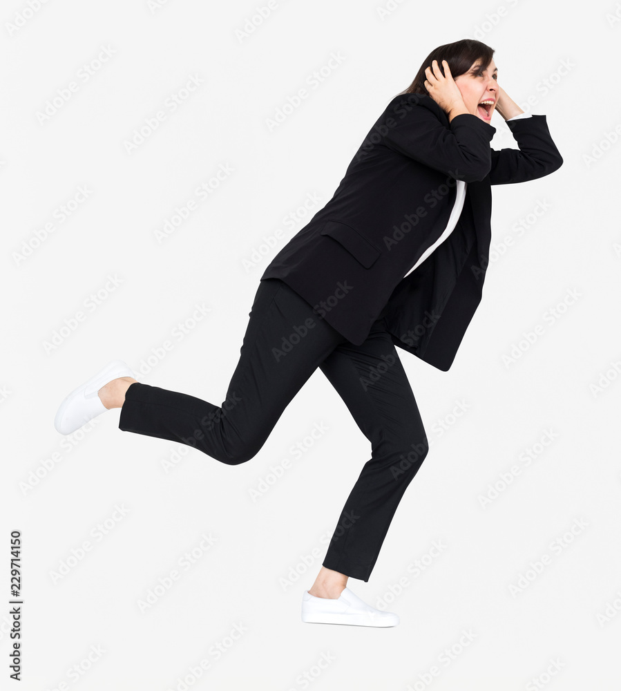 Stressed businesswoman running away from a crisis Stressed businesswoman running away from a crisis