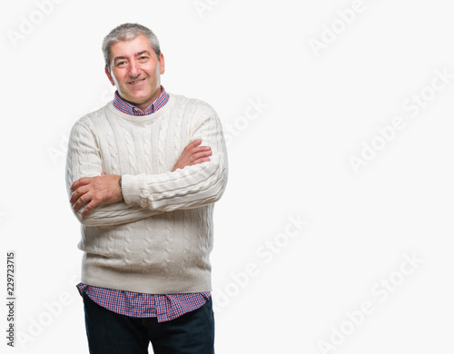 Handsome senior man wearing winter sweater over isolated background happy face smiling with crossed arms looking at the camera. Positive person.