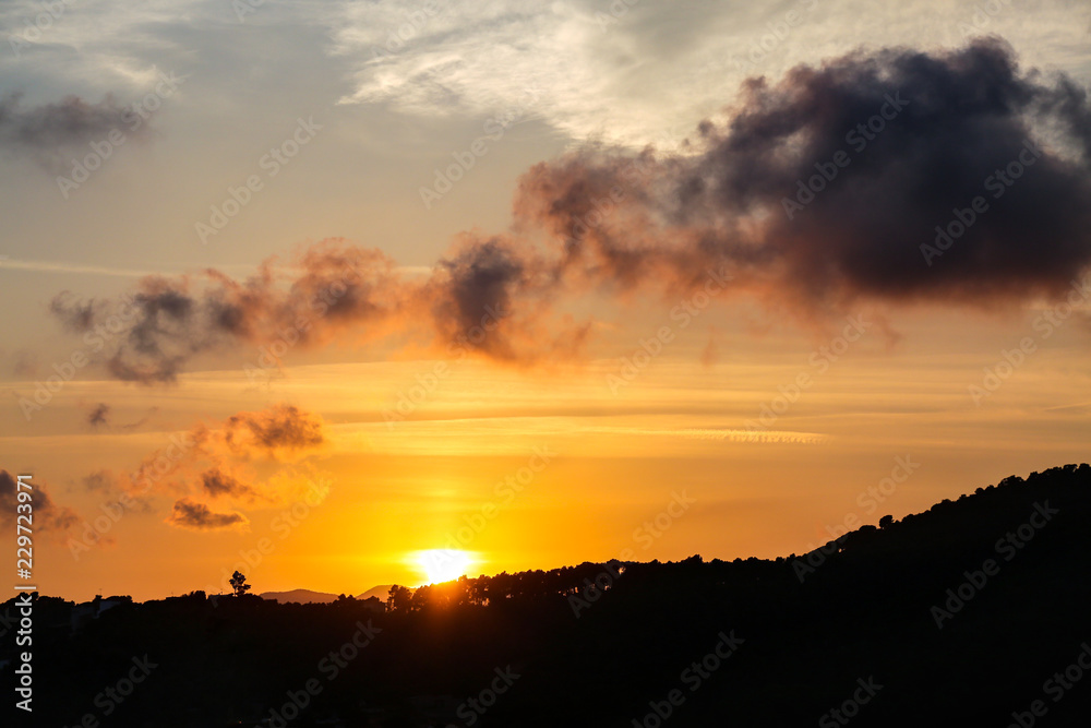 Silhouette of hill at summer sunset. Evening colorful sky. Natural background. Silhouette of hill at summer sunset. Evening colorful sky. Natural background.