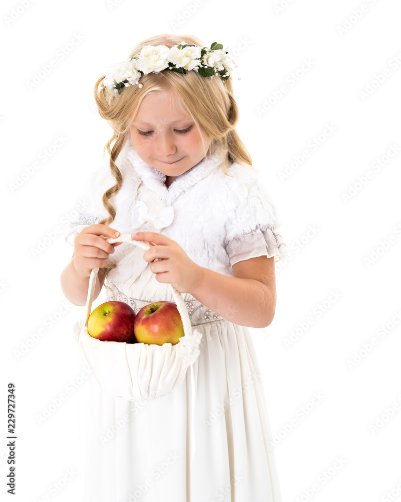 Little girl with a basket of apples. Little girl with a basket of apples.