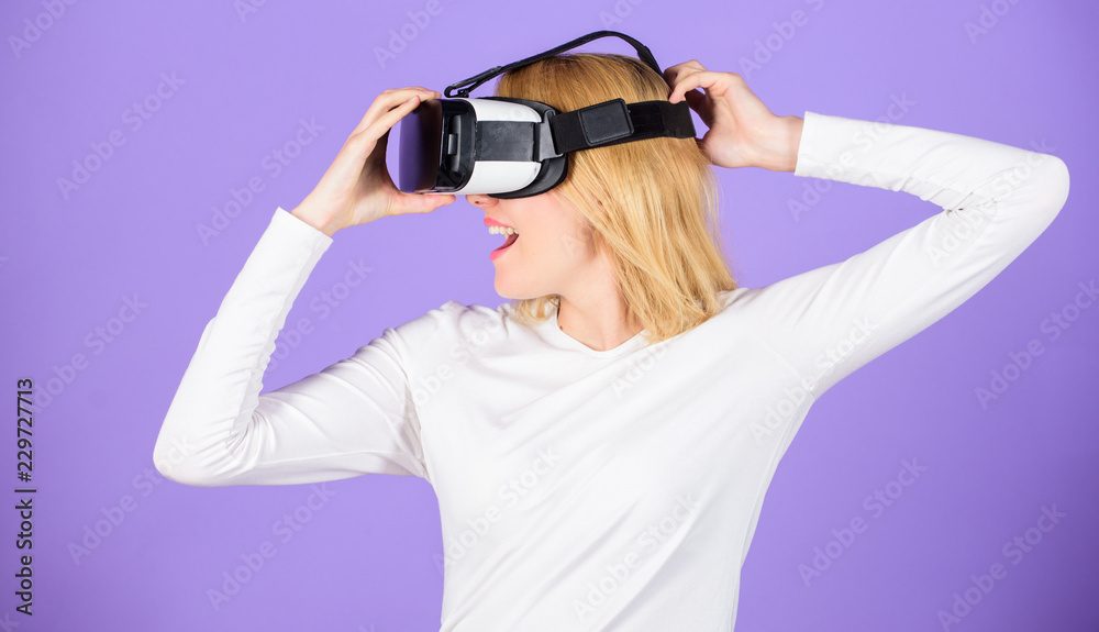 Explore virtual reality. Woman hold vr headset glasses violet background. Digital device and modern opportunities. Virtual reality and future technologies. Girl use modern technology vr headset