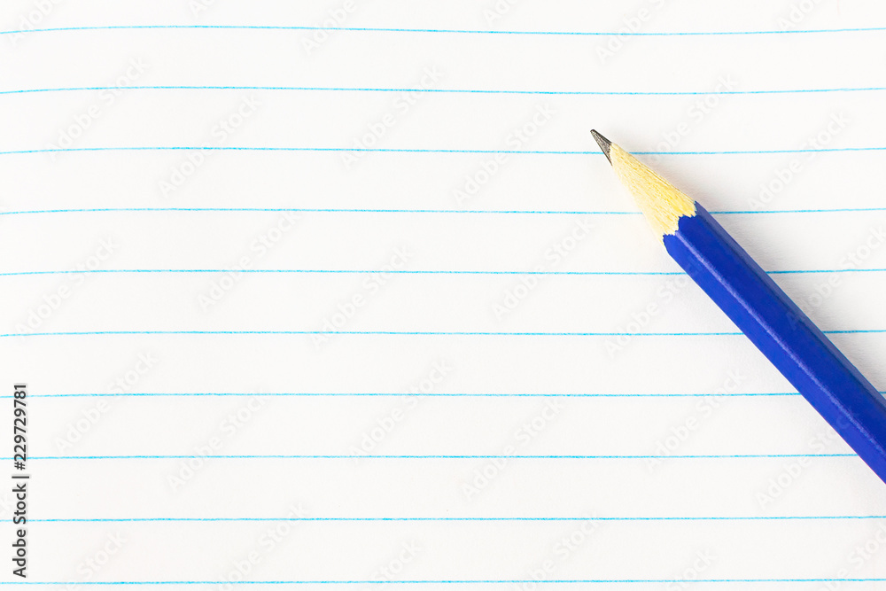 Education concept - blue pencil on book background close-up, mock-up, copy space Education concept - blue pencil on book background close-up, mock-up, copy space
