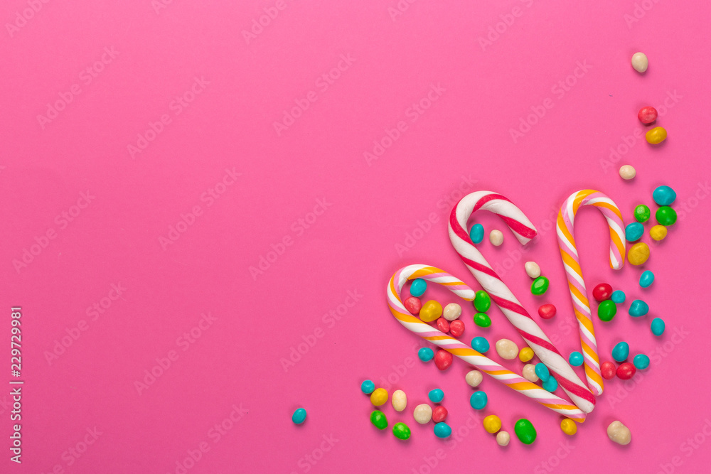 Colorful lollipops on a pink background Colorful lollipops on a pink background