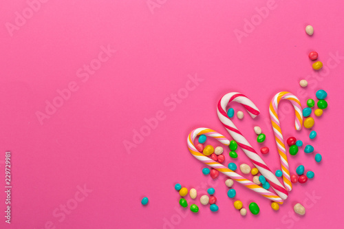 Colorful lollipops on a pink background © fotofabrika