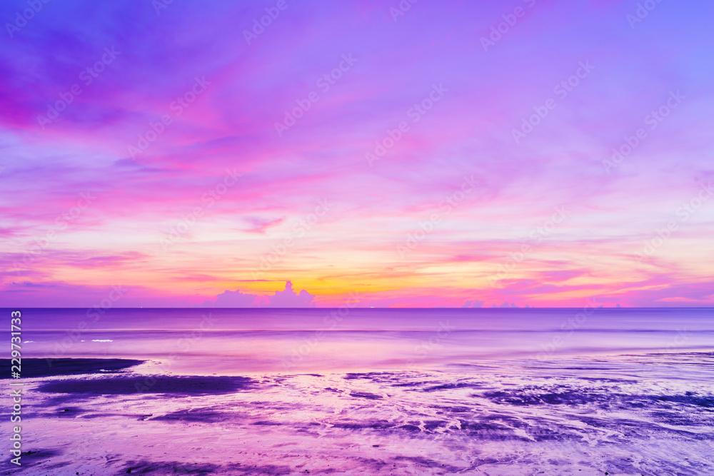 Fototapeta premium Landscape of paradise tropical beach, beautiful sunrise twilight time, Ultra violet pink color sky and sea background.Color of the year 2018 ultra violet pantone.