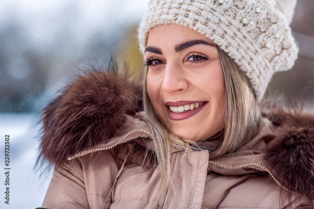 Winter portrait of smiling girl with snowflakes in forest. Winter portrait of smiling girl with snowflakes in forest.