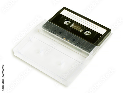 Old cassette in the case. Isolated on white background