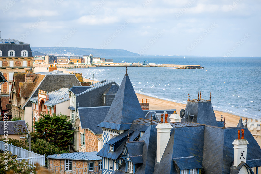 Top view of Trouville city with luxury houses and beautiful beach on the background during the morning light in France Top view of Trouville city with luxury houses and beautiful beach on the background during the morning light in France
