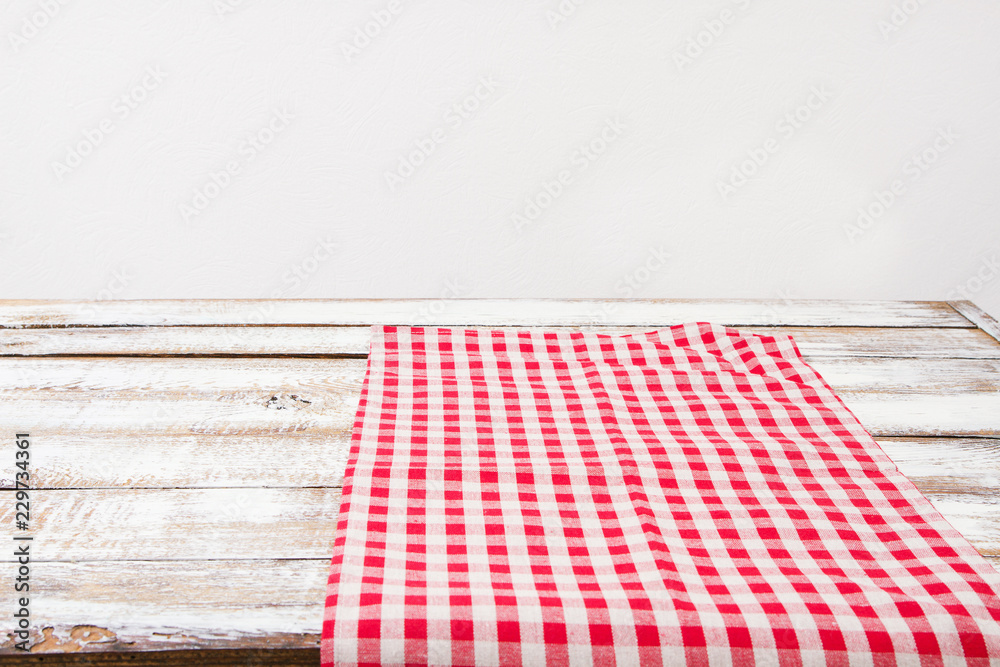 checkered tablecloth on old wooden table, holiday concept