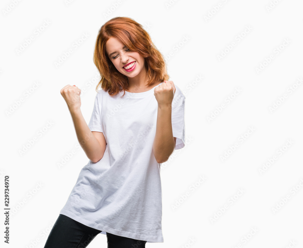 Young beautiful woman over isolated background very happy and excited doing winner gesture with arms raised, smiling and screaming for success. Celebration concept. Young beautiful woman over isolated background very happy and excited doing winner gesture with arms raised, smiling and screaming for success. Celebration concept.